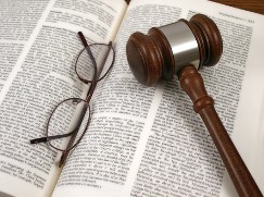 Glasses and Gavel on a Book